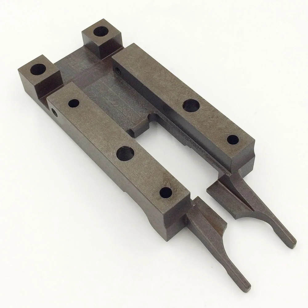 Opposite view of a fork-shaped steel component with stepped faces and open slots