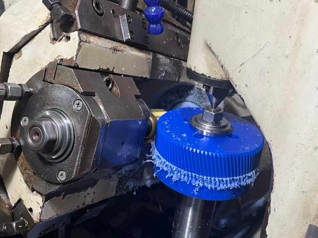 CNC turning of Nylon 66 showing continuous chips and smooth surface finish.