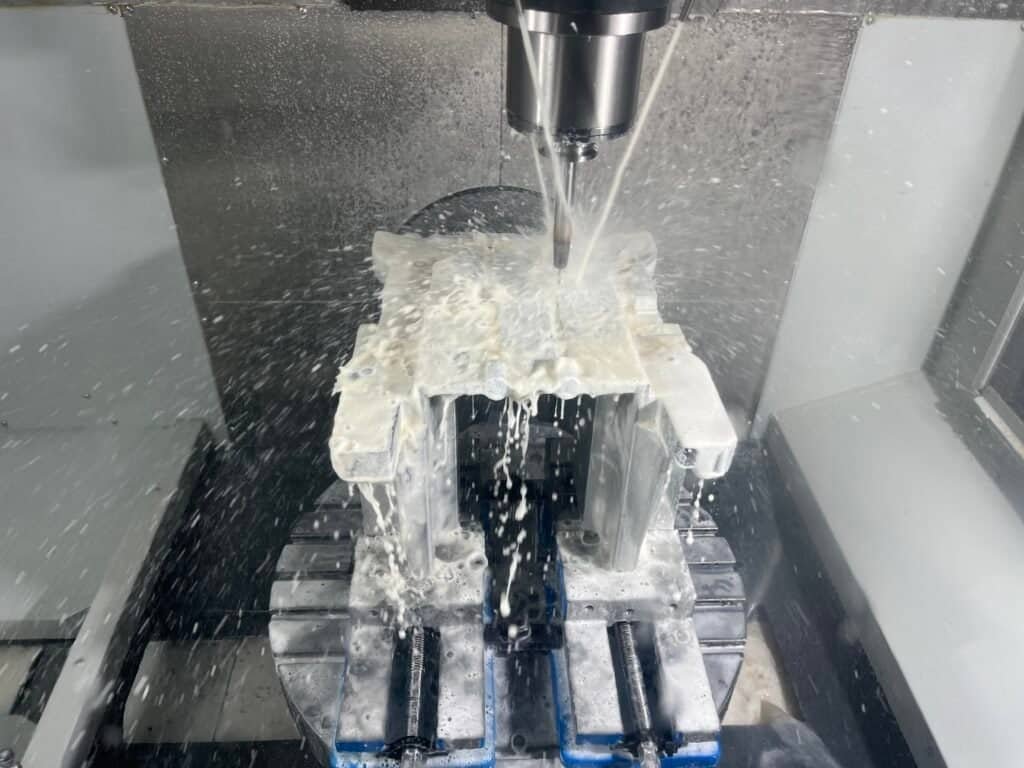 5-axis milling head tilting to machine difficult angles, reducing setup time and improving accuracy.