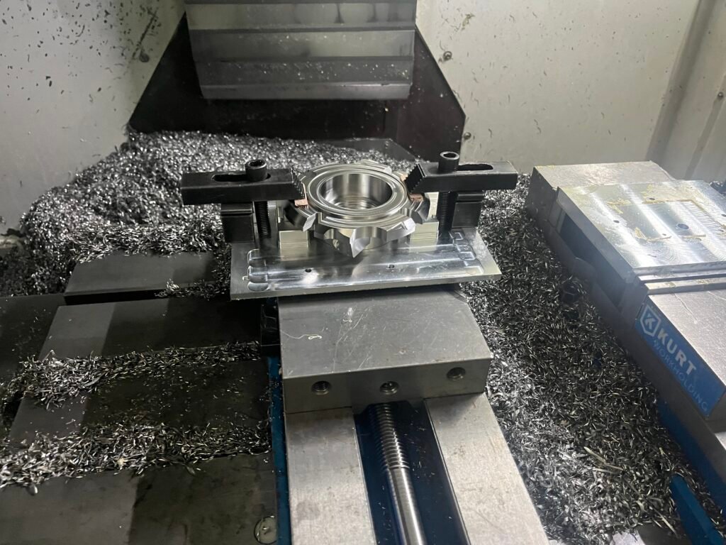 Custom machined soft jaws designed to hold a specific part geometry, representing NRE costs.