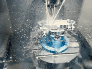 CNC milling machine processing an aluminum part for CNC machining cost analysis