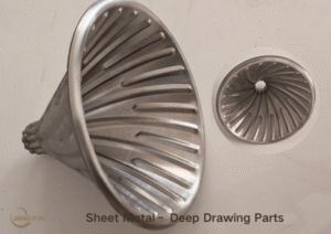 Sheet metal deep drawing process diagram showing punch, die, blank holder, and material flow