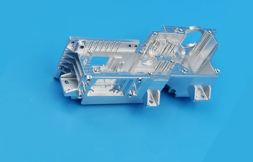 Machined-from-solid 6061-T6 infrared optical component with deep cavities, thin walls and multi-directional features