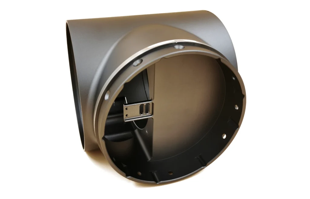 Black anodized 6061-T6 robotics component with a large bore, deep cavity and silver chamfered edges