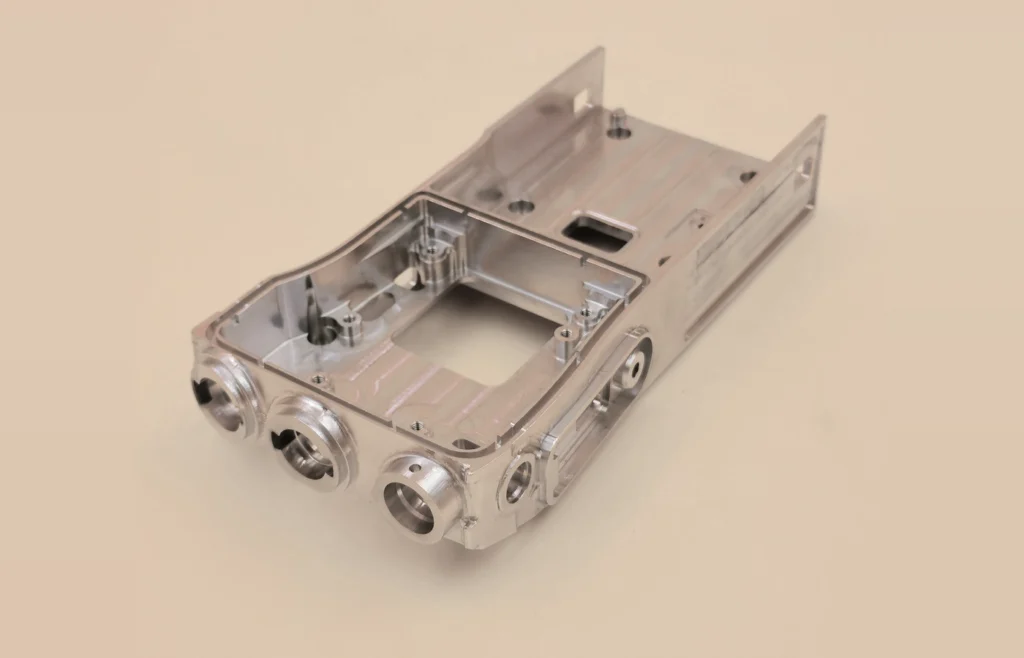 One-piece 6061-T6 wireless device component with multi-face bores, internal pockets and thin-wall features machined using 3-axis and 5-axis CNC