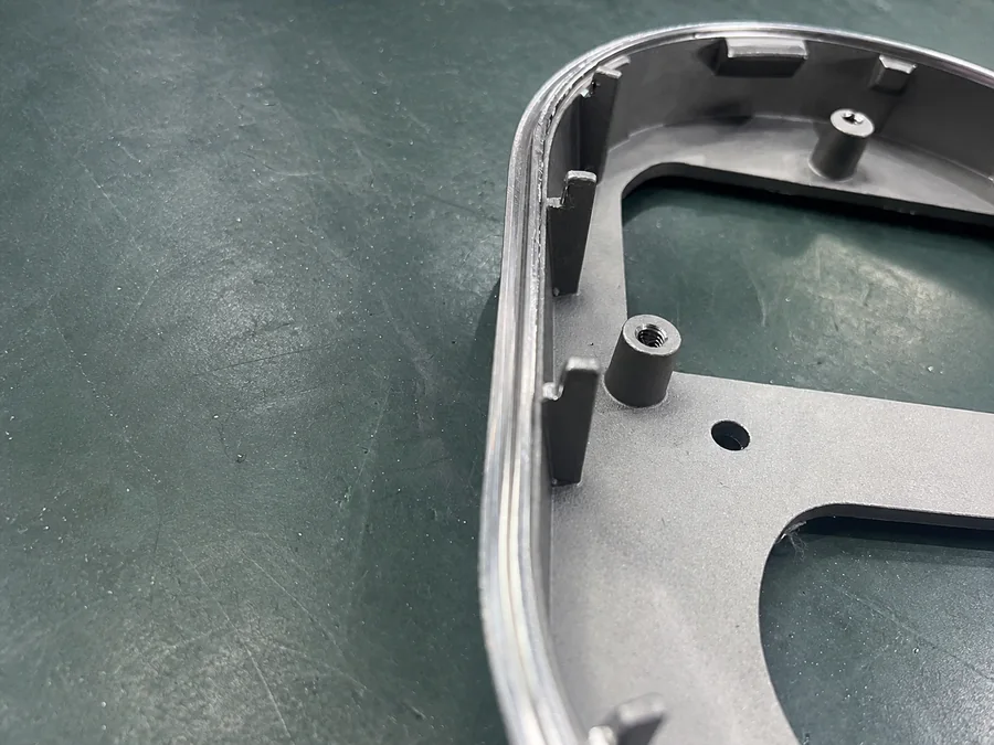 Near-net-shape cast metal blank prepared for CNC finish machining