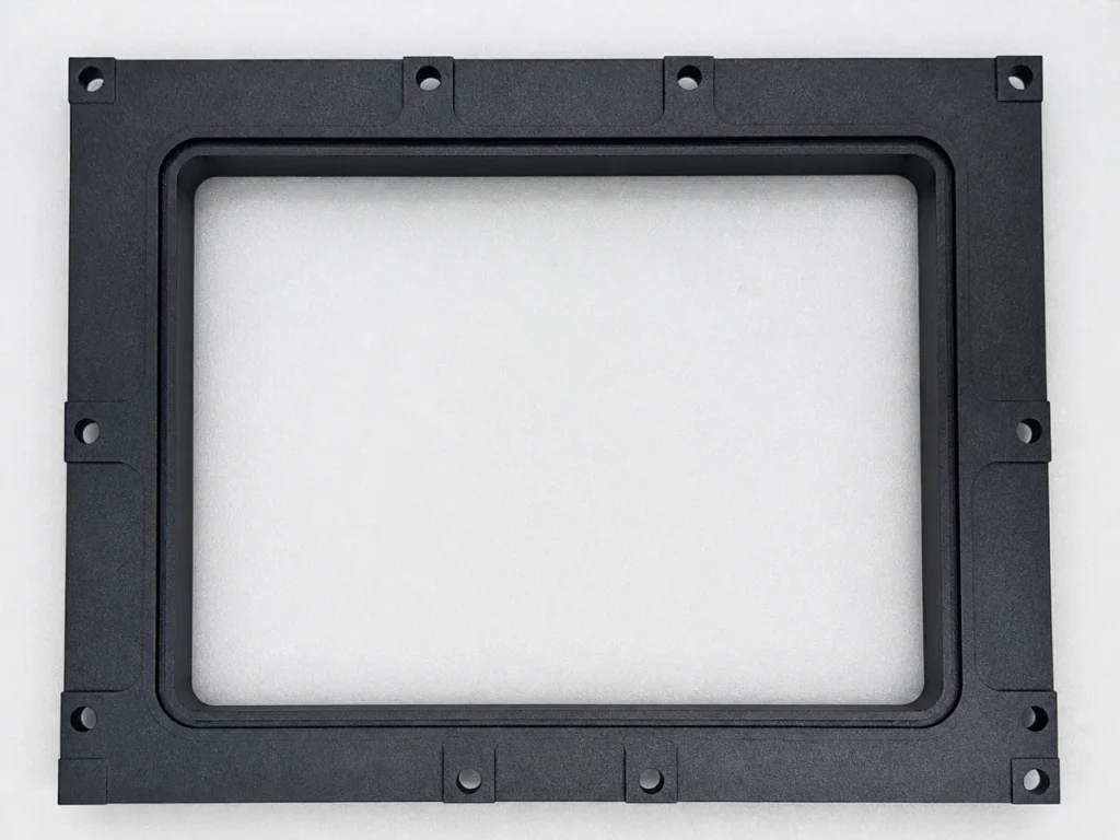Single black CNC-milled frame prototype for design validation