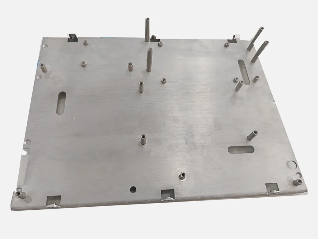 Aluminum sheet metal cover plate with mounting standoffs, round holes, elongated slots and bent mounting tabs
