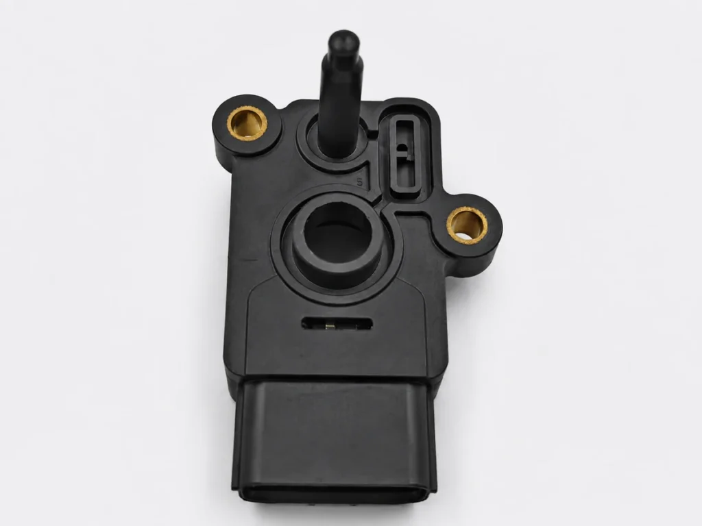 Black plastic component with two visible metal sleeves and molded openings.