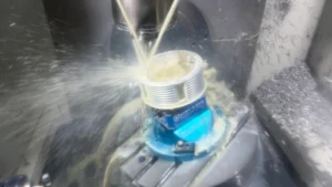 Five-axis CNC machining operation with an aluminum workpiece