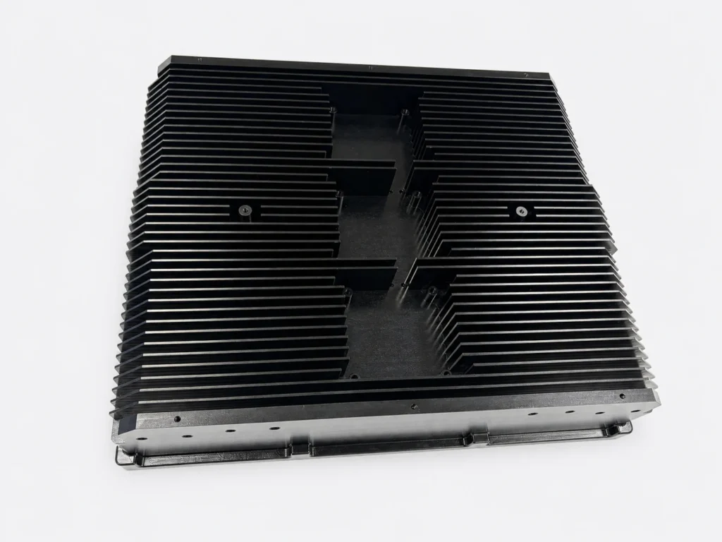 Black-anodized aluminum telecommunications heat sink with parallel fins and mounting holes