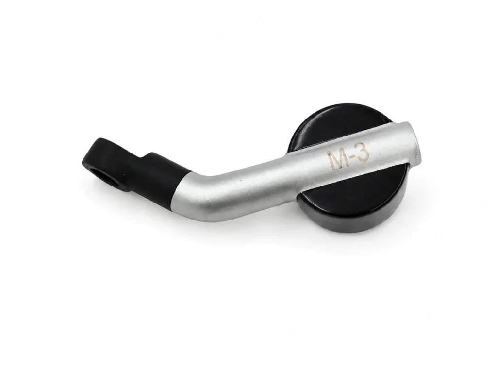 Silver-painted ABS plastic component with black sections and an M-3 marking.