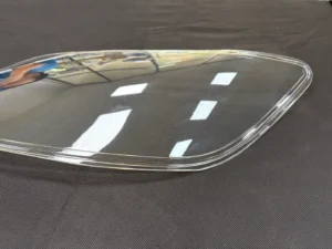 Clear PC automotive lamp cover with a curved surface and raised perimeter edge