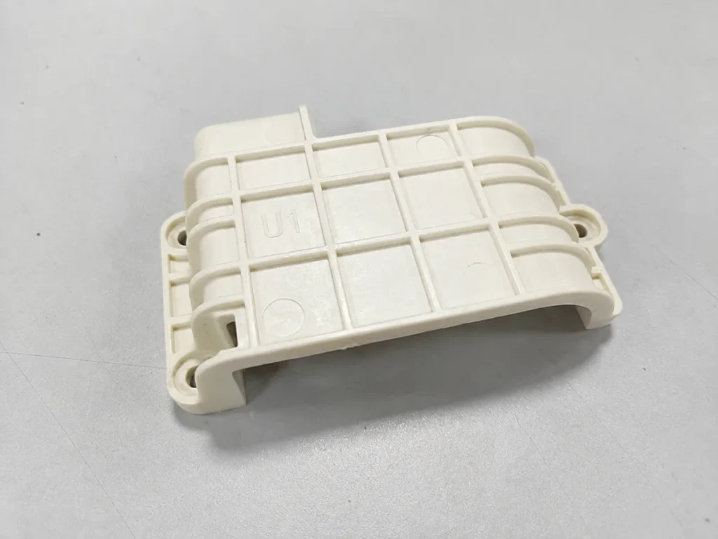 ABS injection-molded part with reinforcing ribs and mounting holes manufactured by SAMSHION.