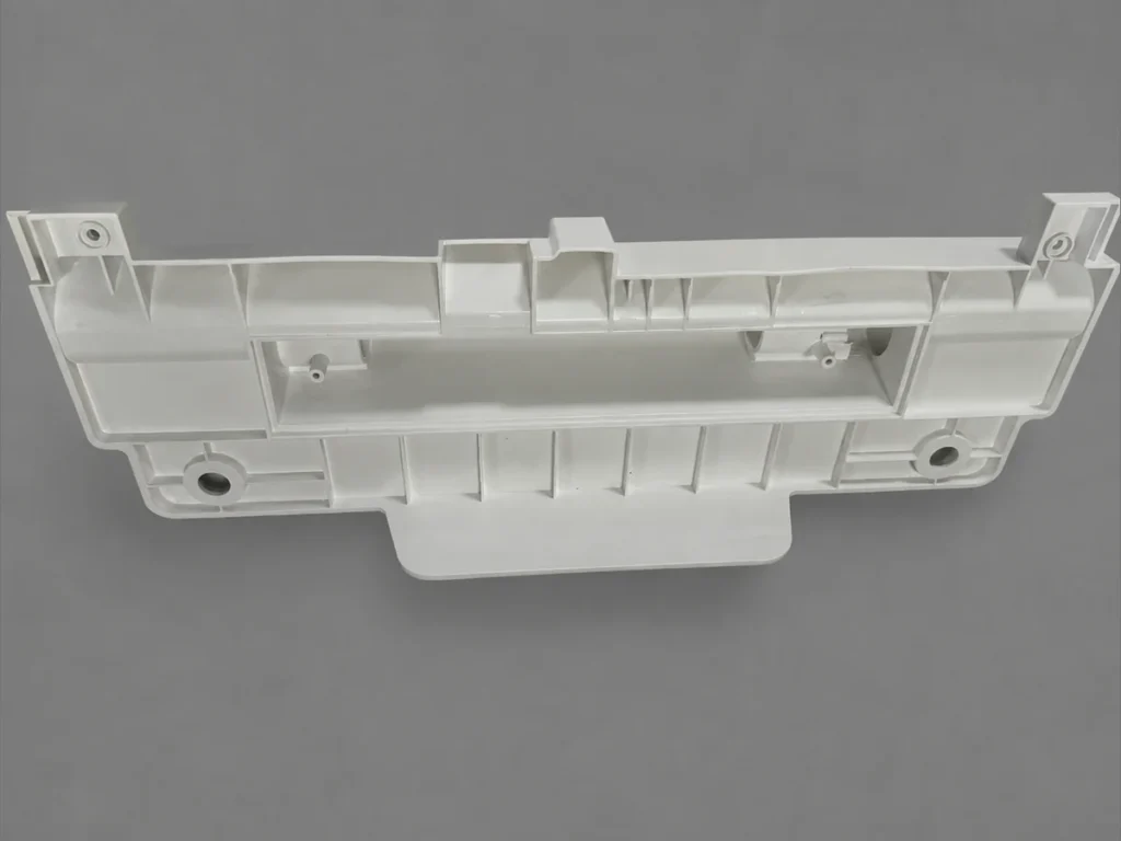 White ABS+PC injection-molded component with ribs, bosses and holes, produced by SAMSHION using rapid tooling.