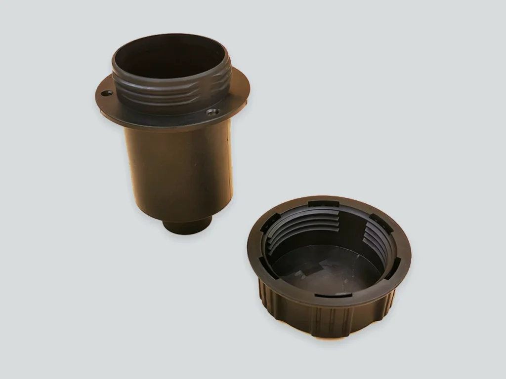 Two PP automotive injection-molded components showing mating external and internal threads.