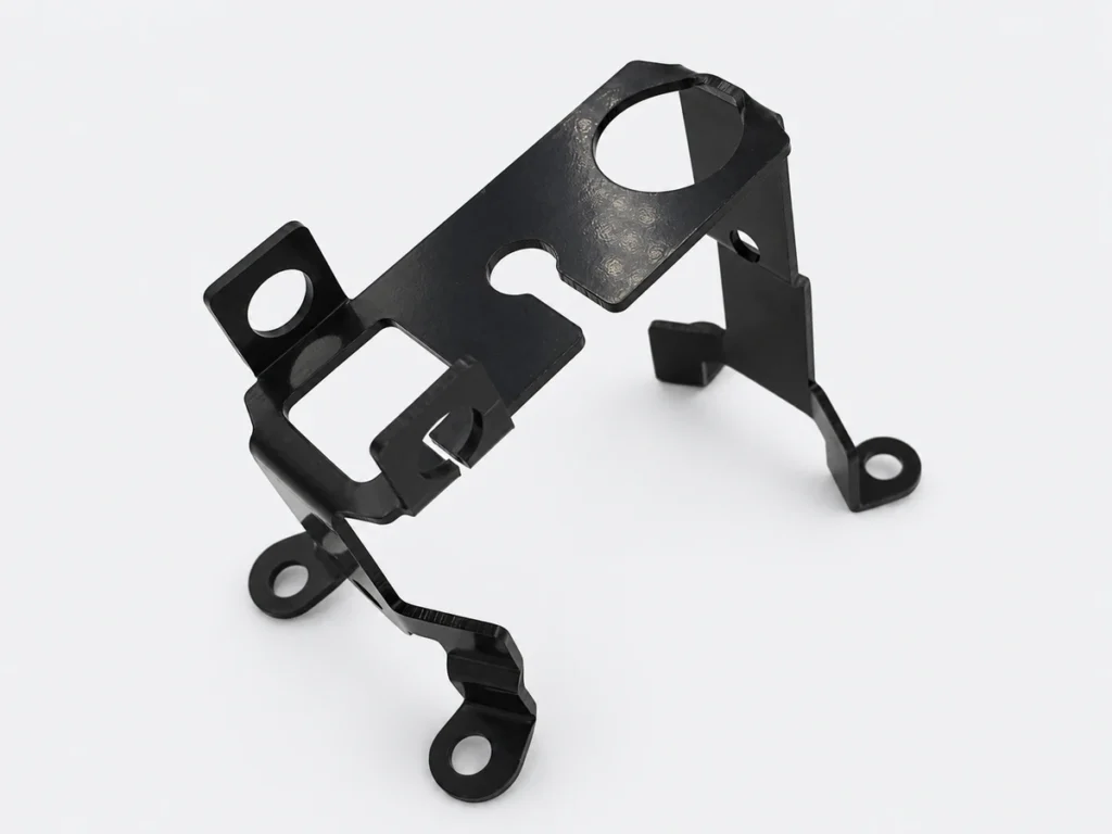 Black sheet metal prototype bracket with bends, mounting tabs, circular holes and cutouts.